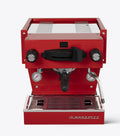 Red espresso machine with 'La Marzocco' branding on a white background